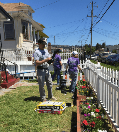 Volunteers helping plant a new garden